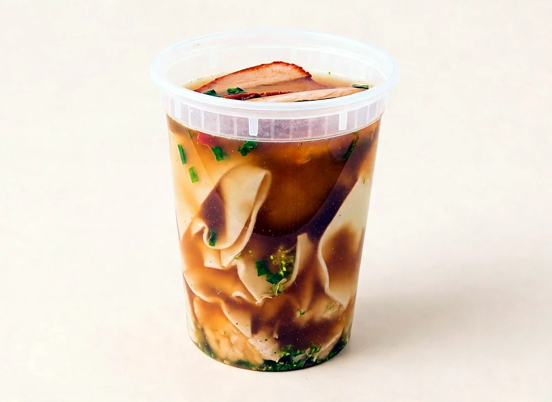 Wonton soup with sliced pork and greens